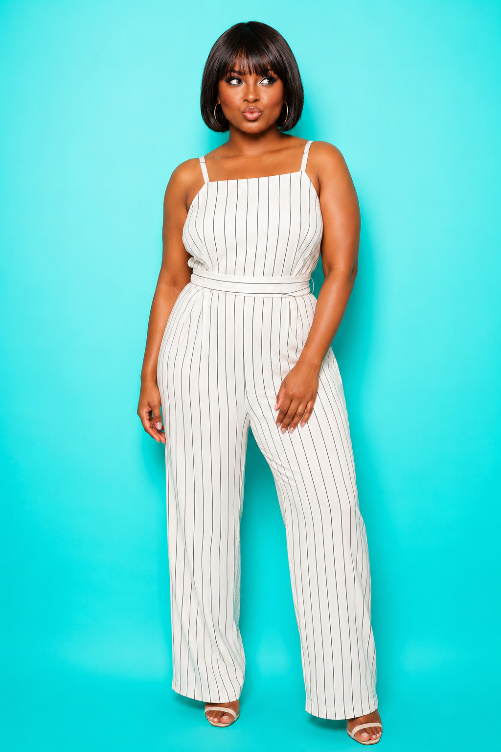 Nefe Fashion-forward in a pinstriped jumpsuit